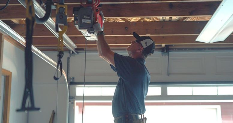 Specialist installing LiftMaster opener in Woodstock Ga